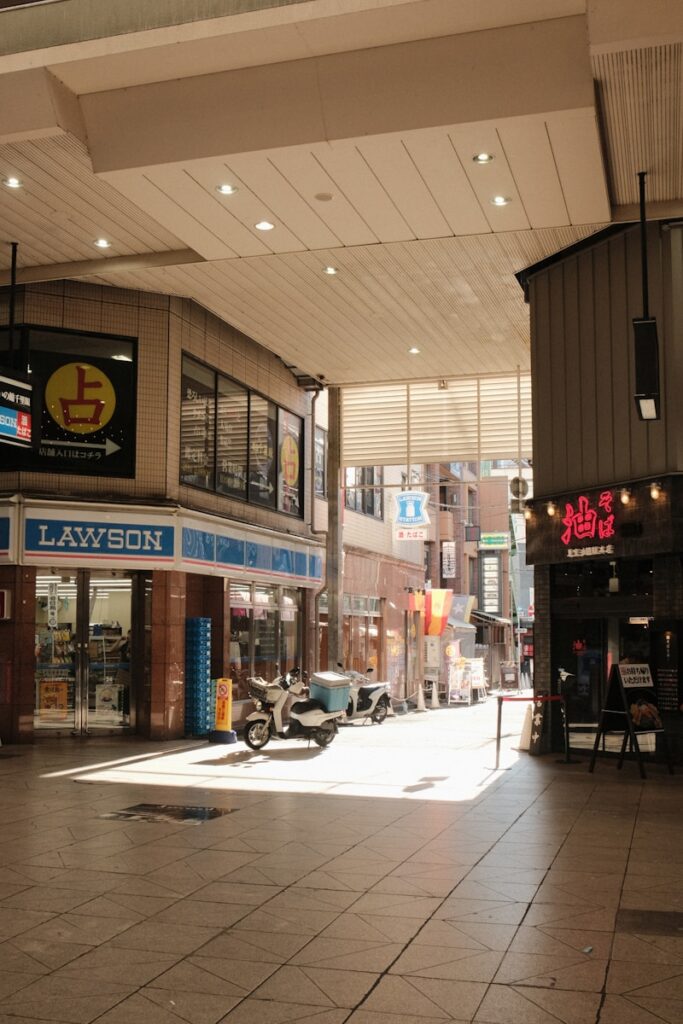 Covered street with lawson store and scooter